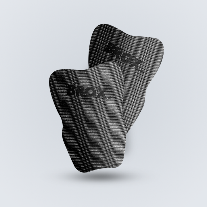 Pair of black BROX. replacement EVA impact pads for Orion shin guards
